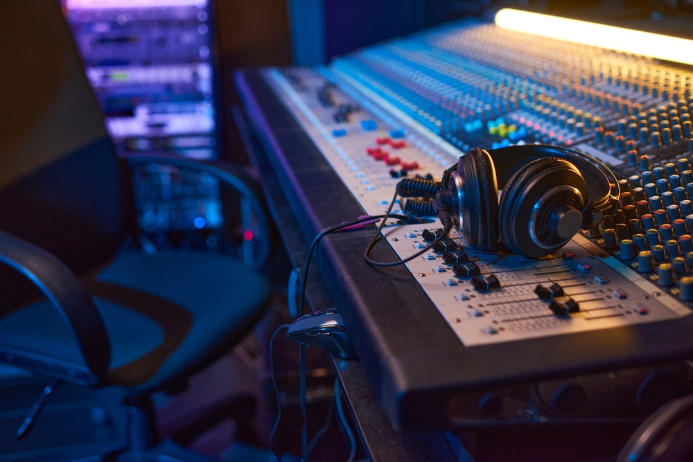 Close-up,Of,Sound,Mixing,Board,With,Headphones,On,It,For